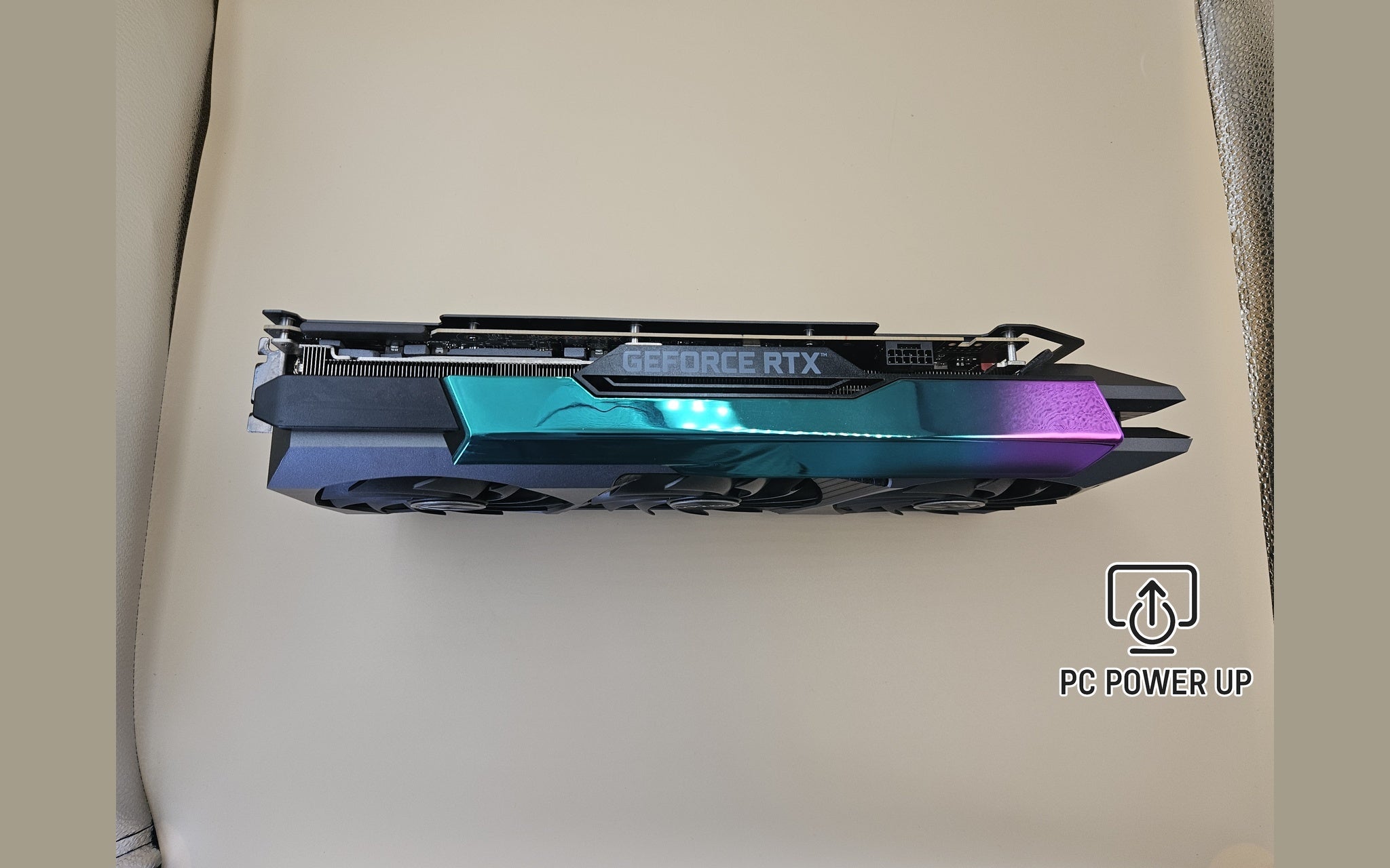 ZOTAC GeForce RTX graphics card side profile with teal and purple RGB accent