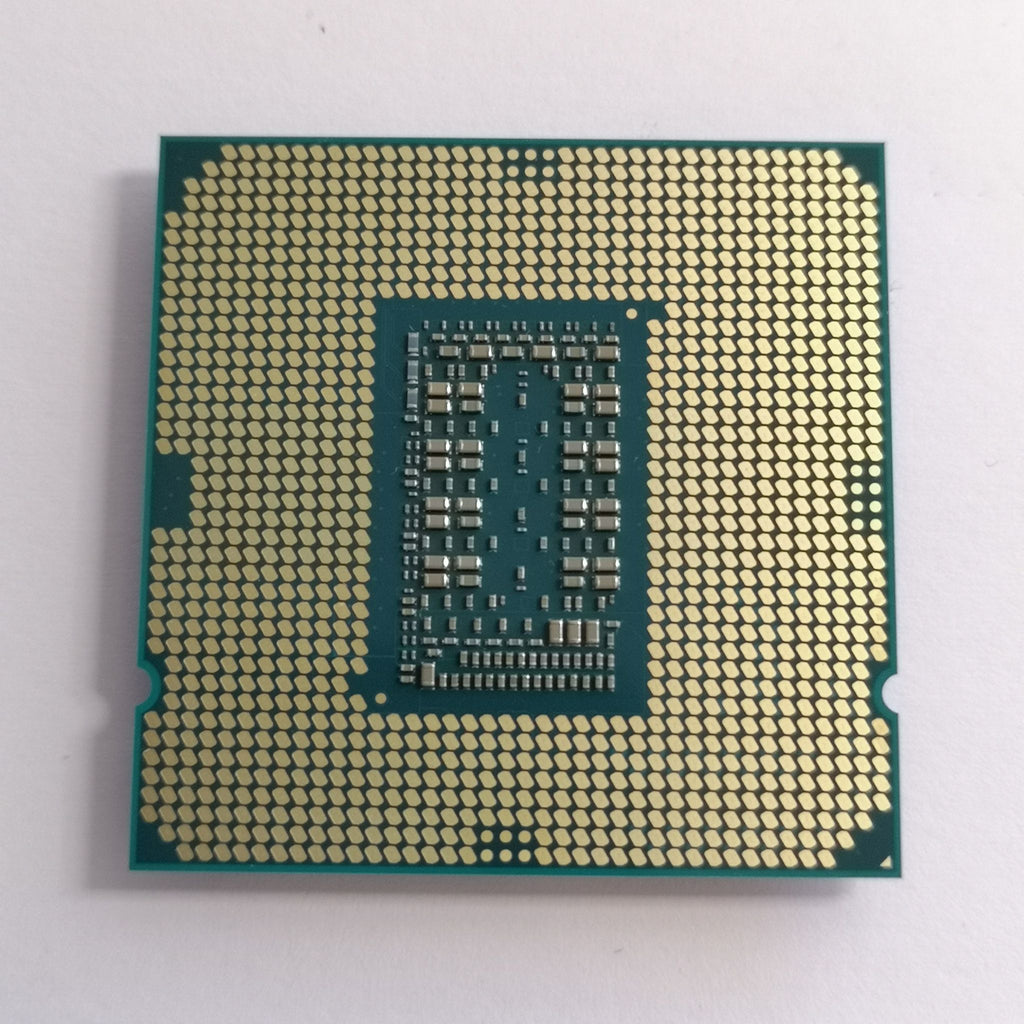 Intel Core i5-11600K CPU chip with gold LGA pin grid, green package